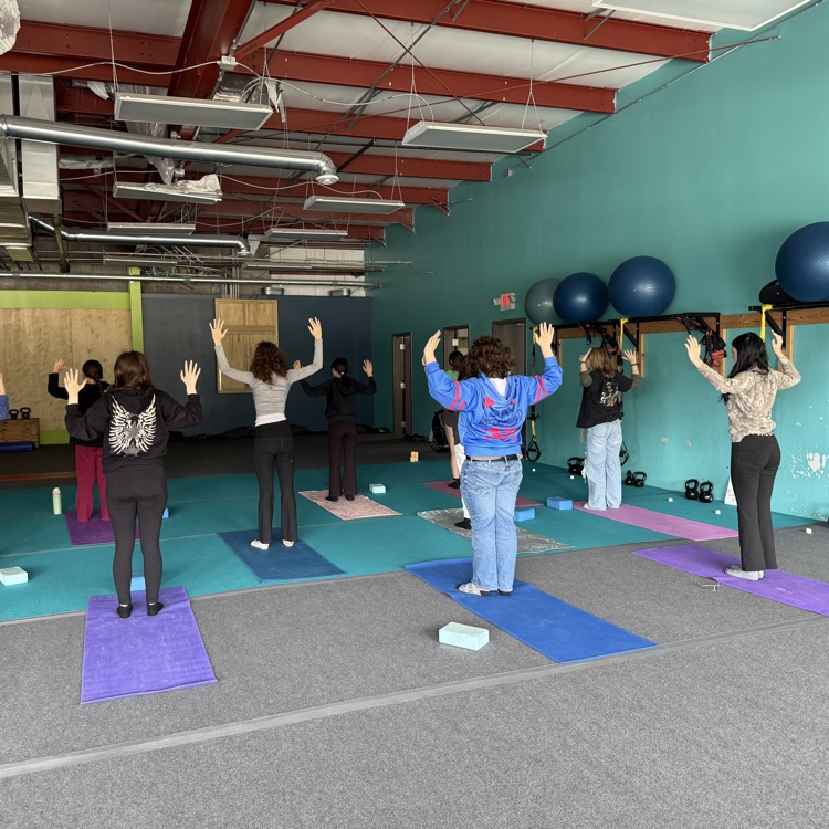 Students doing yoga at Breathe and Believe 