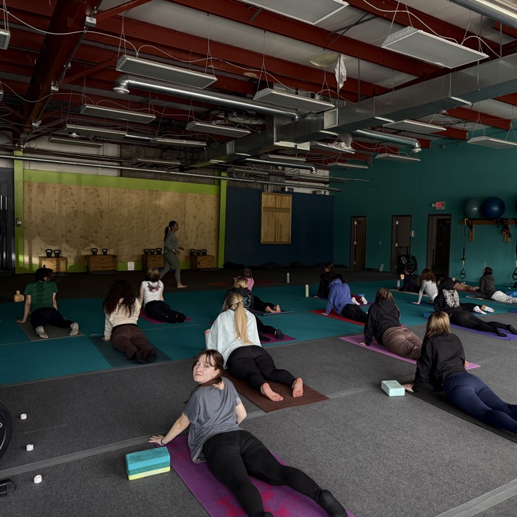 Students doing yoga at Breathe and Believe 