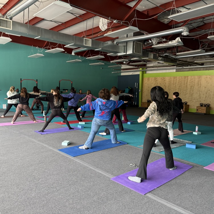 Students doing yoga at Breathe and Believe 