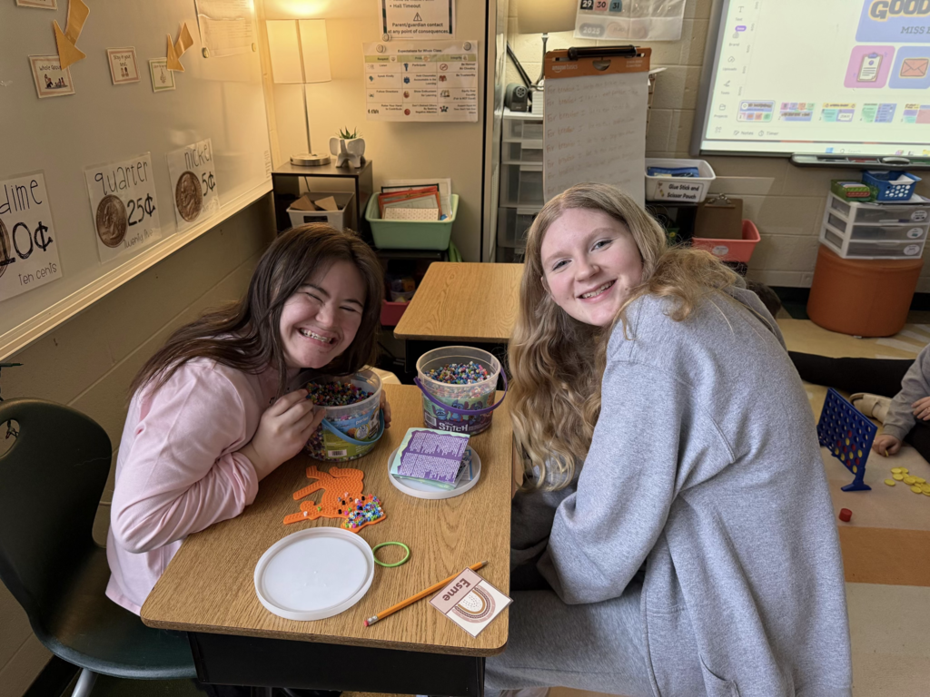 Students spend time together completing a classroom activity.