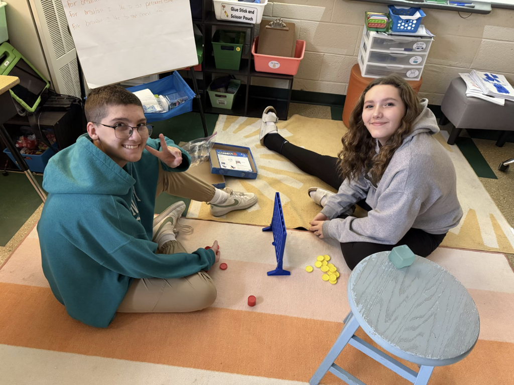Students spend time together playing a game.