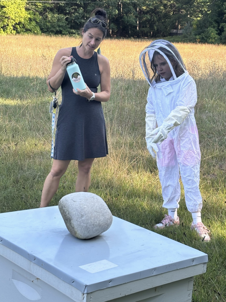 Student demonstrating Bee Keeping skills 