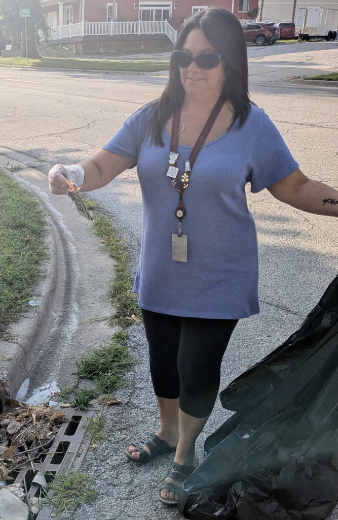Marnie picking up garbage