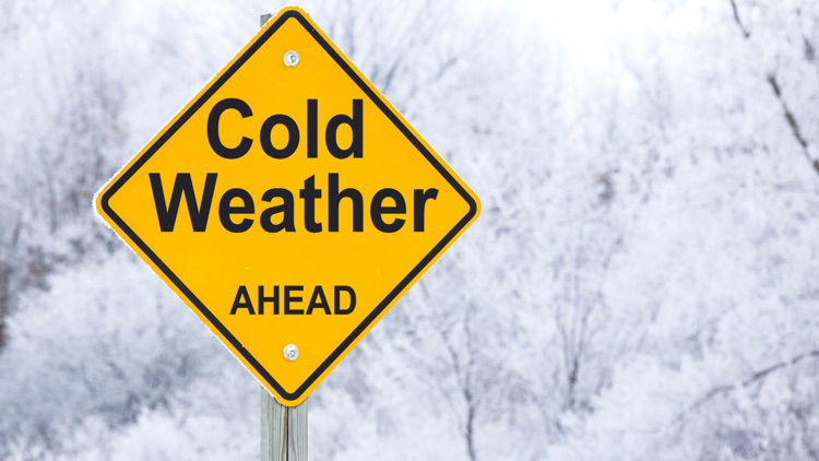 caution sign with cold weather ahead