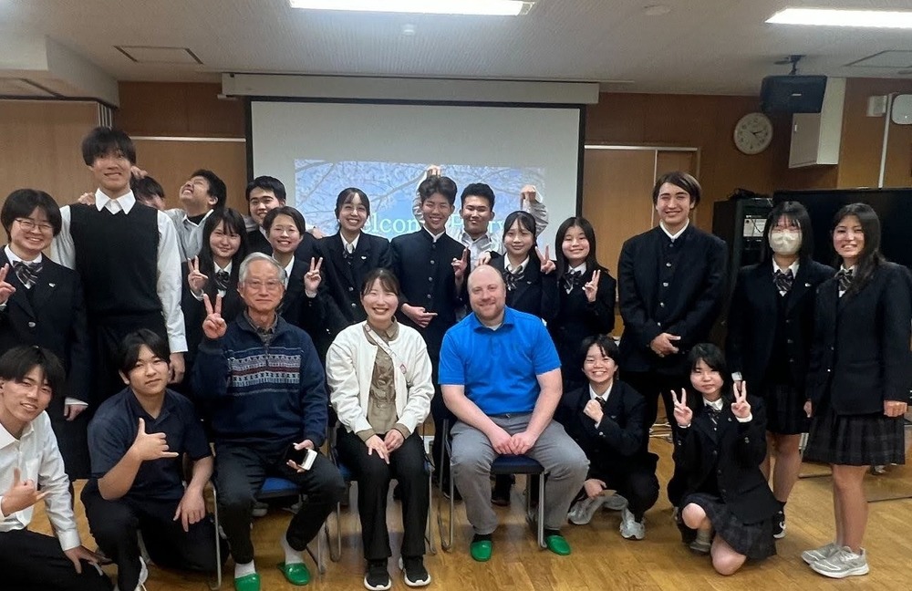 An image of educator Steve Kass during his visit to Japan with a Japanese classroom.