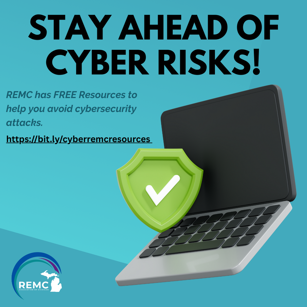 Graphic promoting REMC cybersecurity resources. Large text at the top reads “Stay Ahead of Cyber Risks!” To the right is a graphic of an open laptop with a large green shield and white checkmark symbol in front of it, representing security. REMC Association of Michigan logo appears in the lower left corner on a blue background.