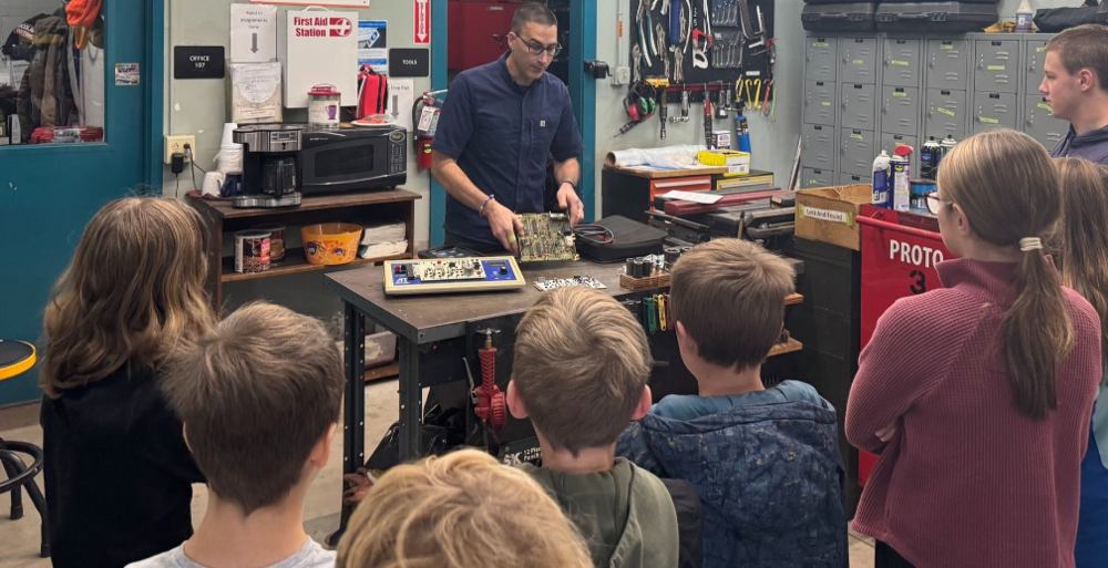 A CTE instructor at the Copper country ISD is demonstrating some tech for students in the classroom.