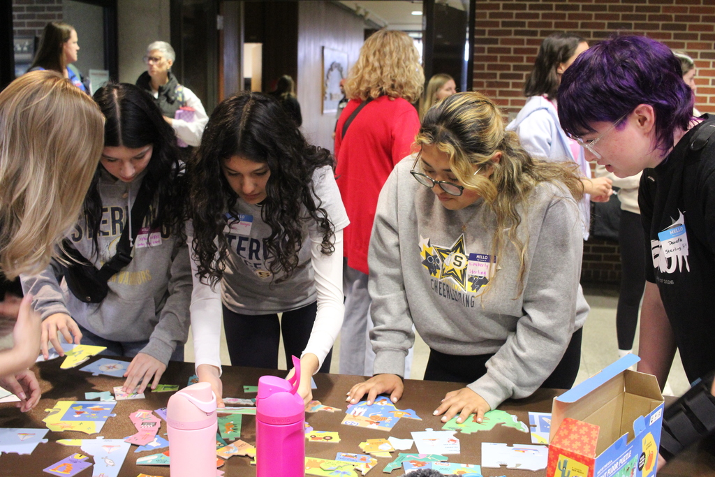 Students playing a minute to win it game 