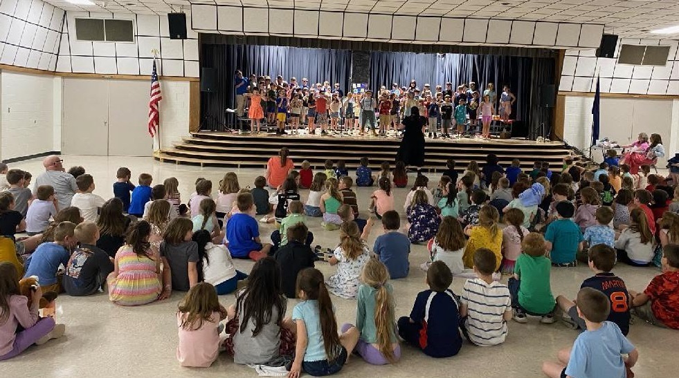 students watching play