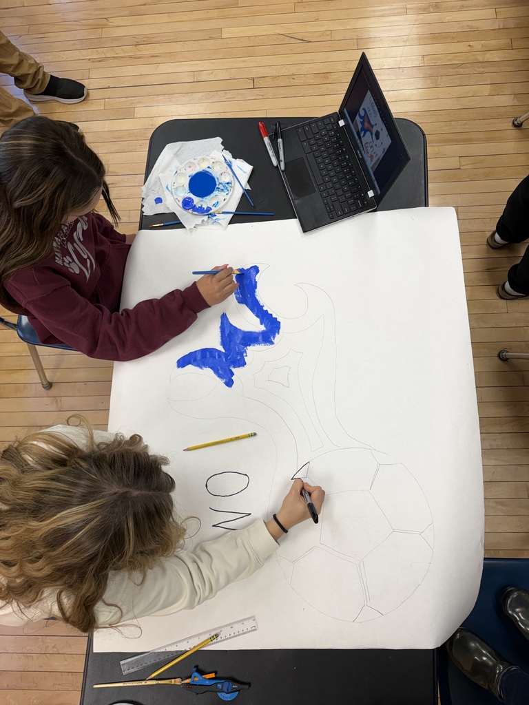 8th Grade Girls creating posters for the soccer team