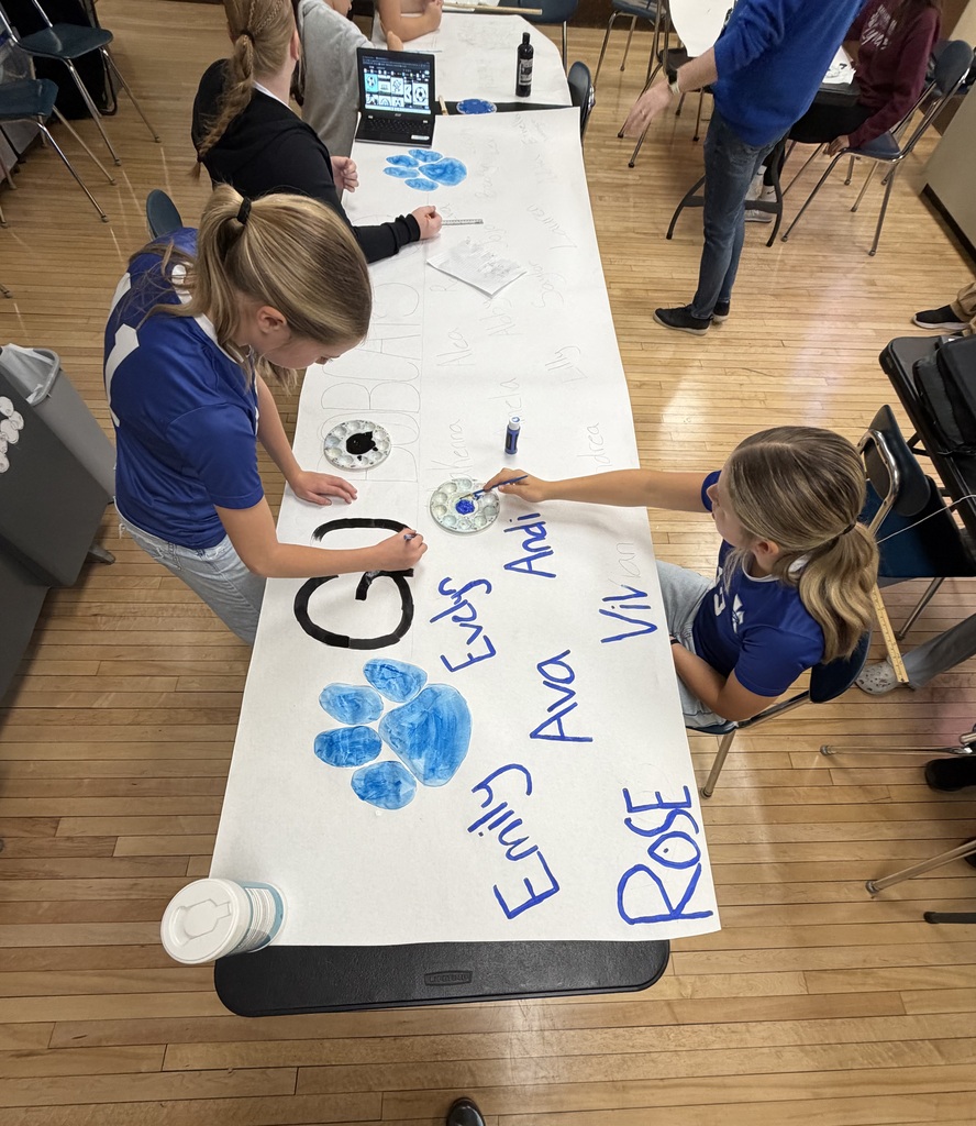 8th Grade Girls creating posters for the soccer team