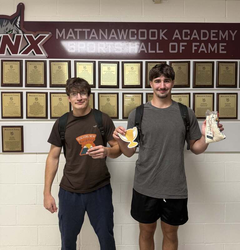 Max and John holding trophies