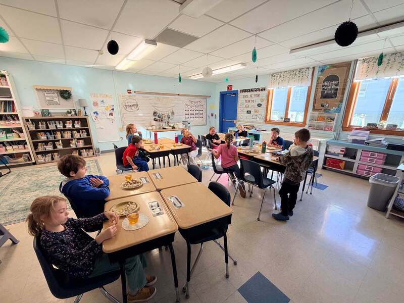 Students in classroom eating snacks