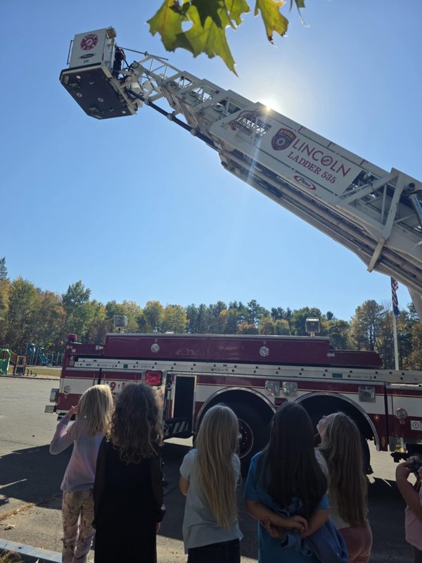 Fire truck with kids looking