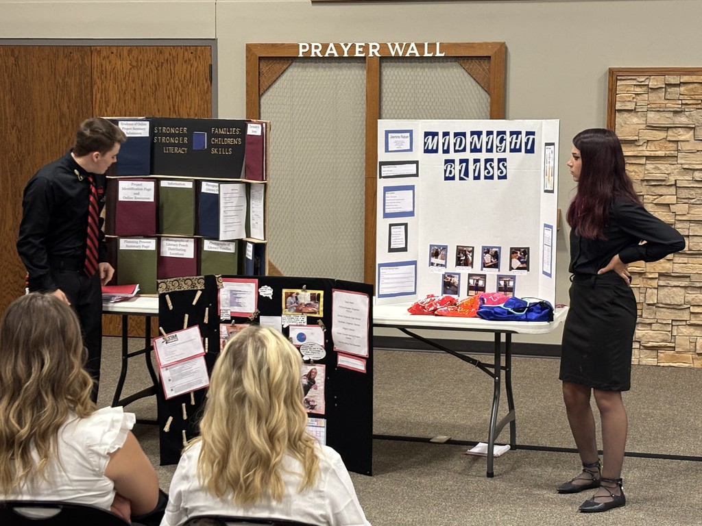 Jasmine presenting as a district officer.