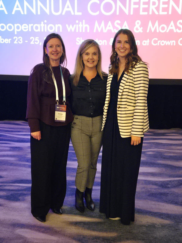 Christy Coursey, Alyssa Phillips and Shaina McMunn standing together at an awards ceremony