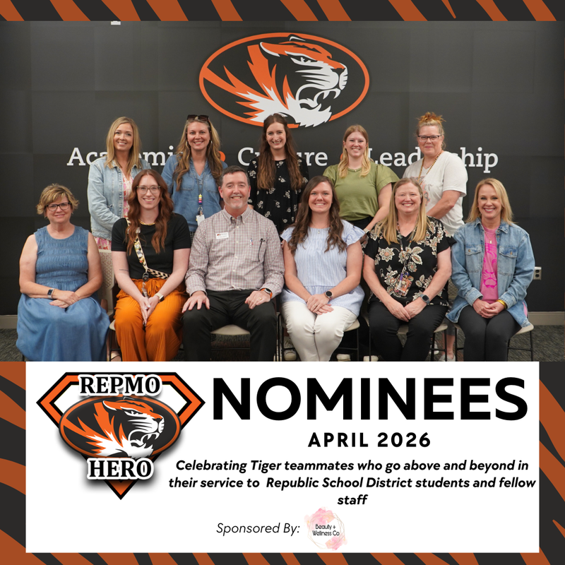 Group photo of RepMo Hero nominees for March 2026. Staff members pose in two rows in front of a Republic Tigers logo. Text below celebrates their service to Republic School District students and staff, sponsored by Beauty + Wellness Co.