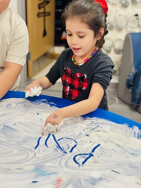 2nd graders writing words using shaving cream