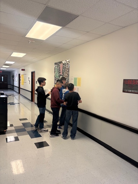 7th grade history students doing a gallery walk