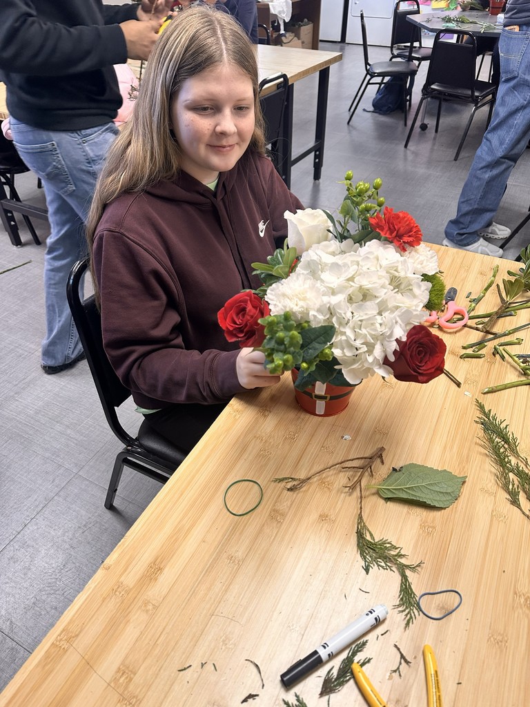 Floral design students working on bulldog blooms orders
