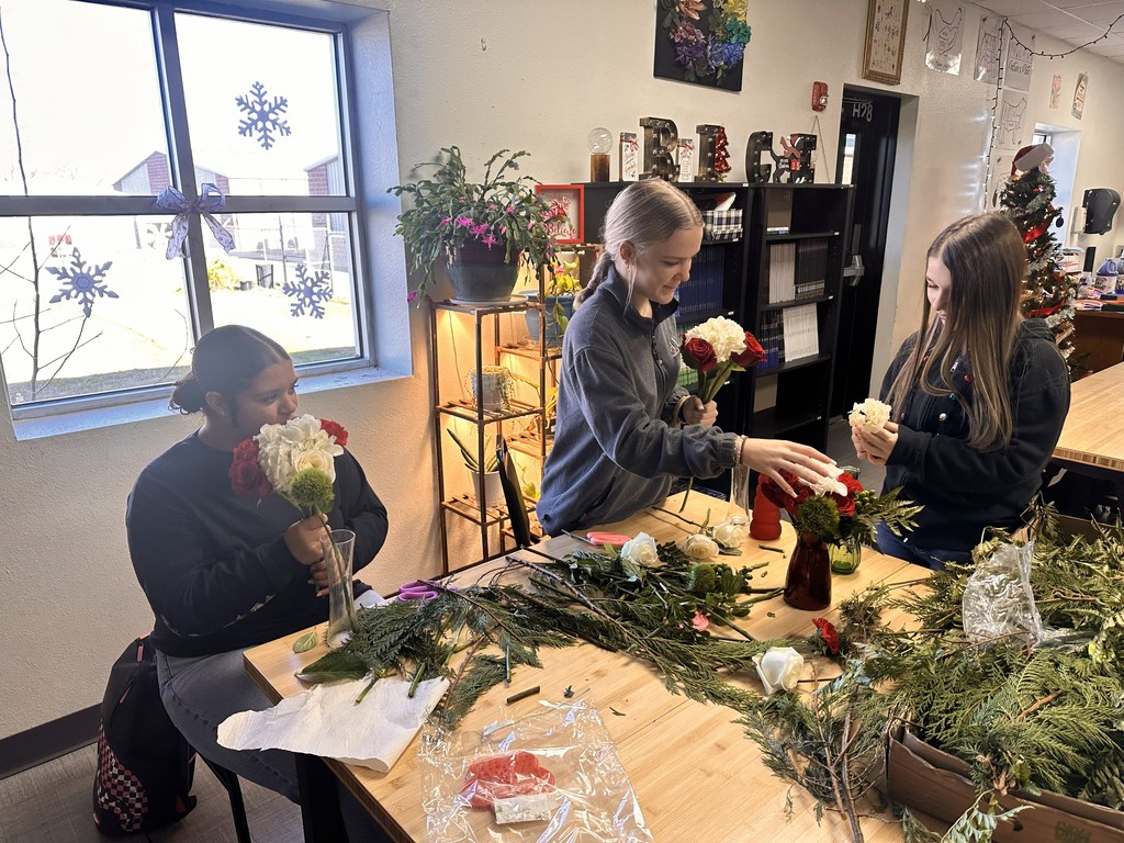 Floral design students working on bulldog blooms orders