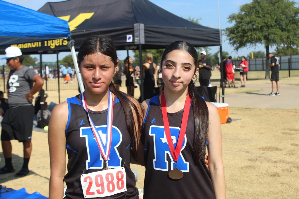 cross country runners with medals