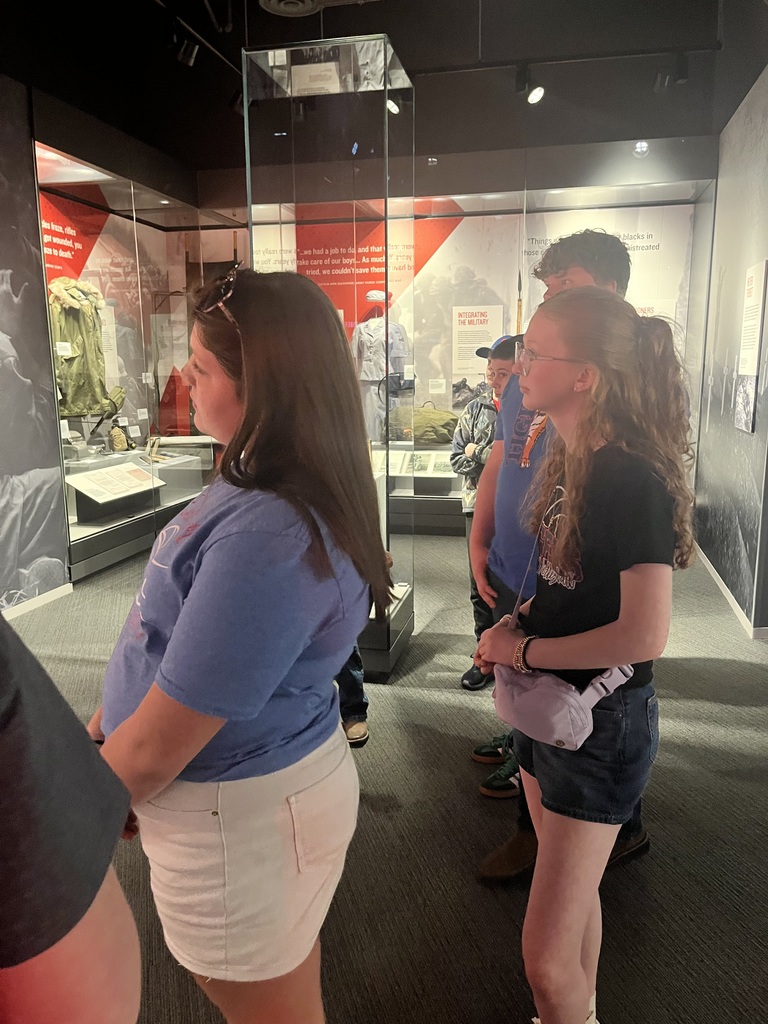 Students listening to the tour guide. 
