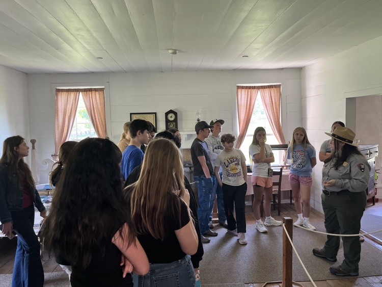 Students listening to the story of the Ray House and the purpose it served during the Battle of Wilson’s Creek