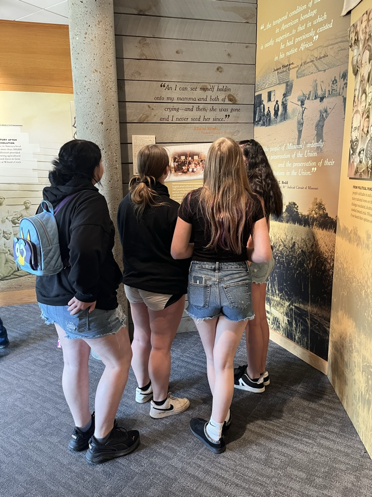 Students viewing an exhibit  