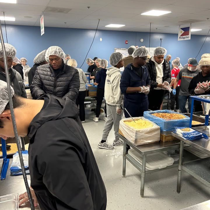 Male Mentoring service project at Feed My Starving Children