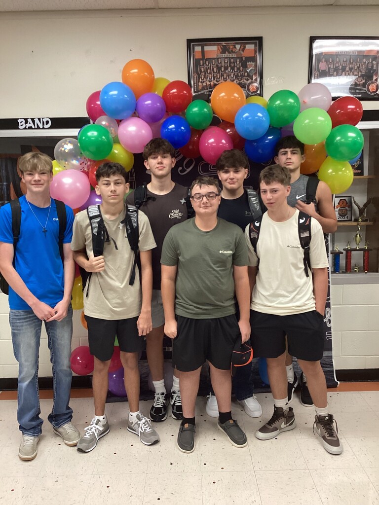 Boys posing for first day photo.