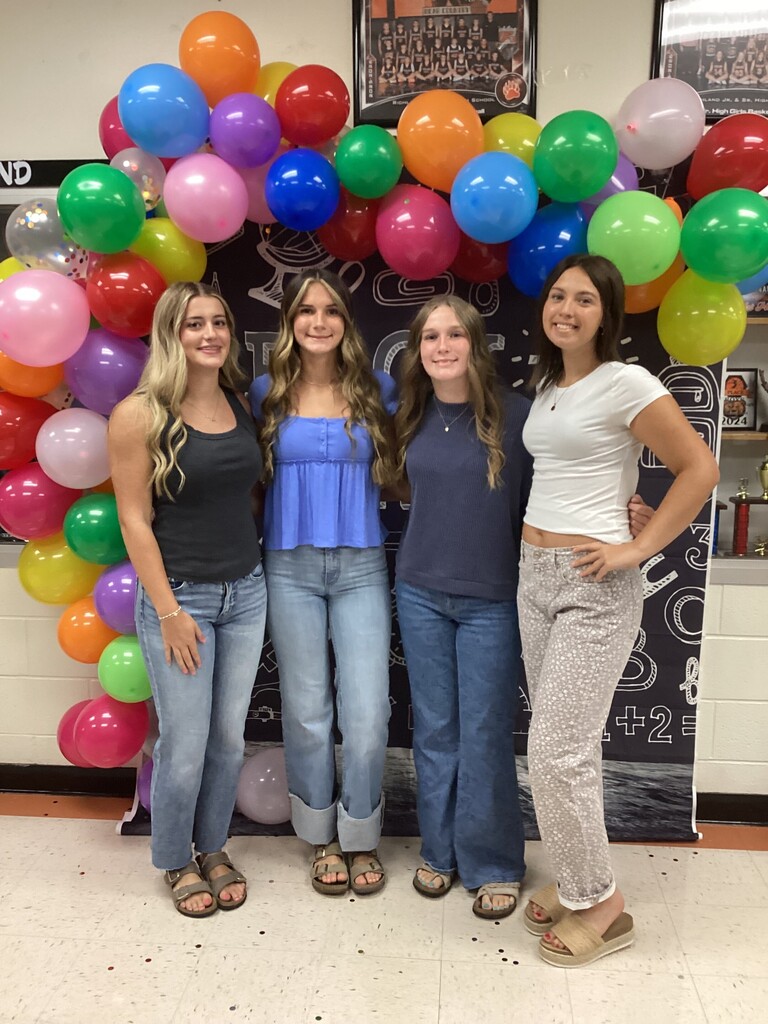 Student Council President posing with friends.