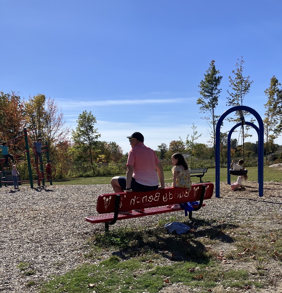 teacher and student on bench