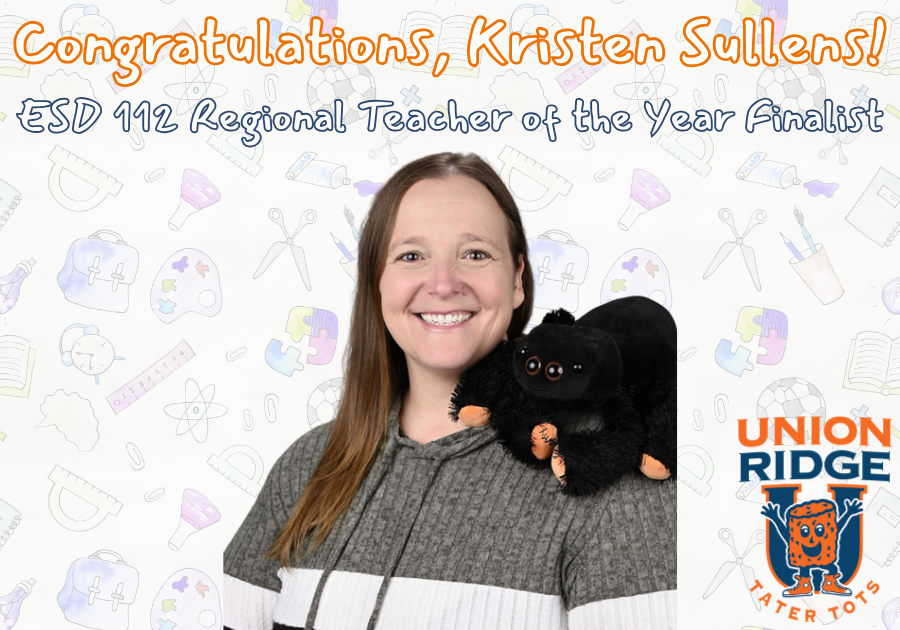 A picture of a smiling Kristen Sullens with a stuffed spider resting on her shoulder
