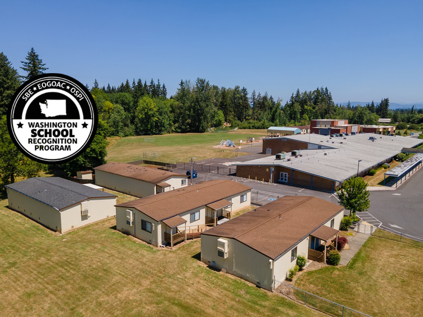 An aerial image of South Ridge Elementary School with a Washington School Recognition Program Badge overlaid