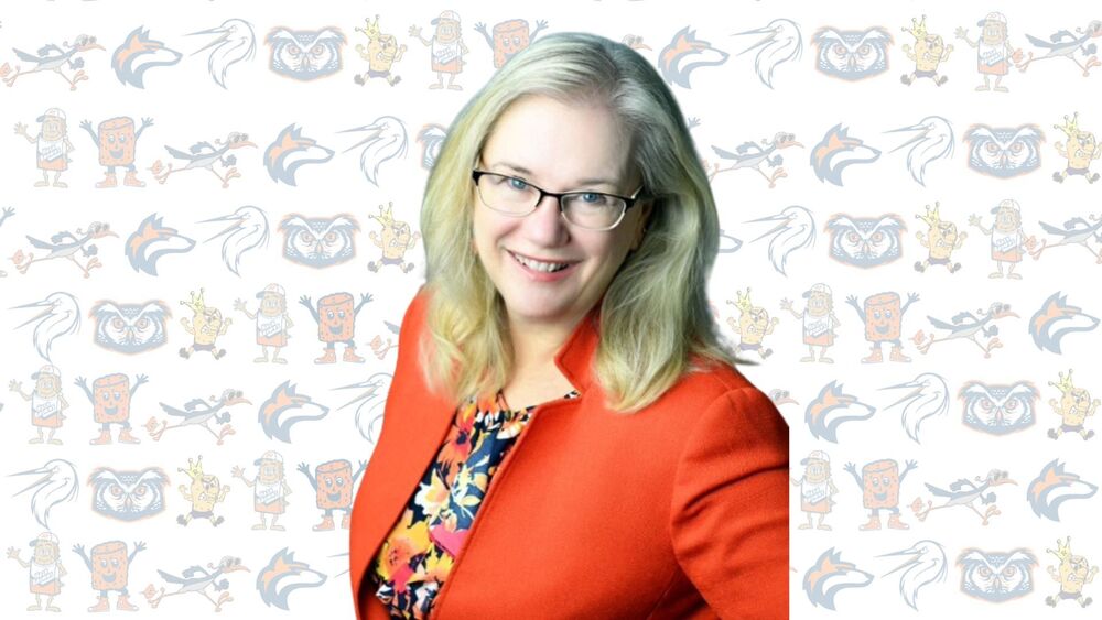 An image of Kathy Funk-Baxter with all of our school mascots as a college in the background