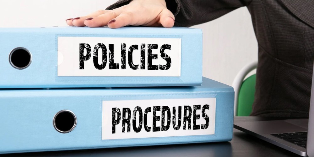 Binders labeled "Policies" and "Procedures"
