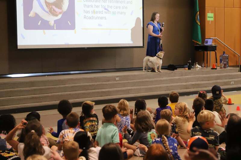 Anne Lamping and Fergie on stage at a school assembly