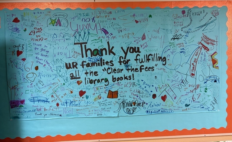Students at Union Ridge signed a poster thanking the community for their support in clearing the book fines for the school