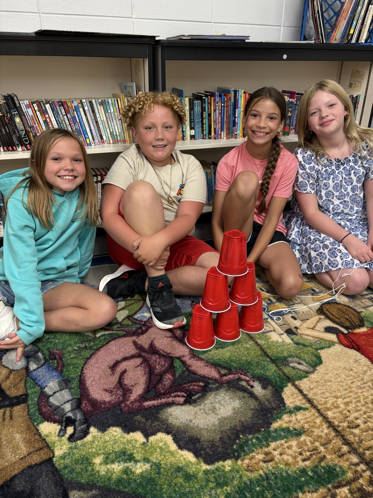group of kids with completed stack