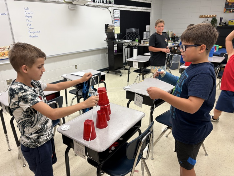 group of kids with completed stack