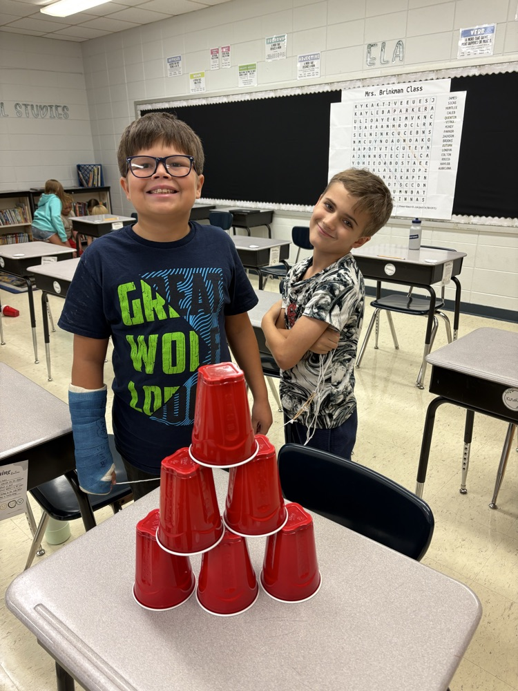 group of kids with completed stack