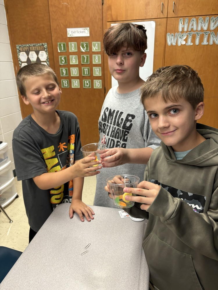 students saving gummy worm
