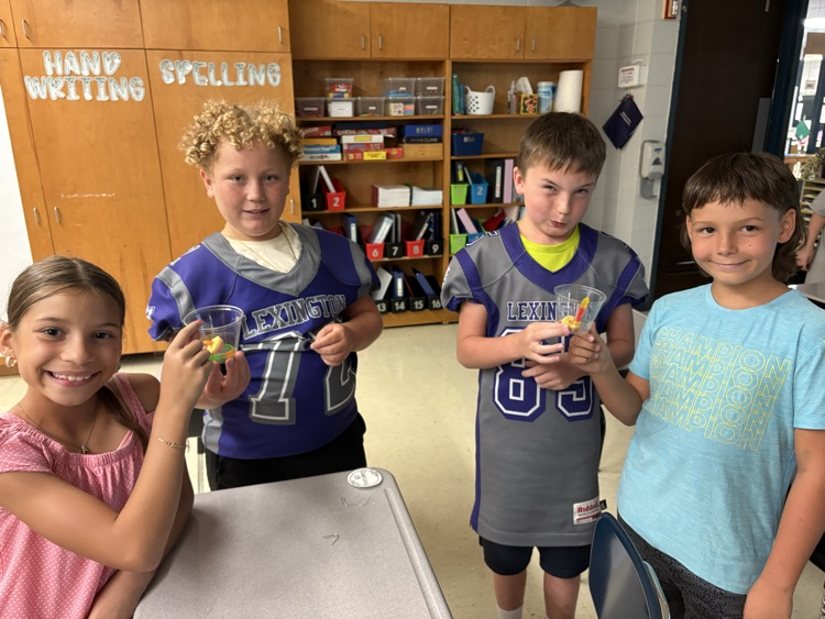 students saving gummy worm