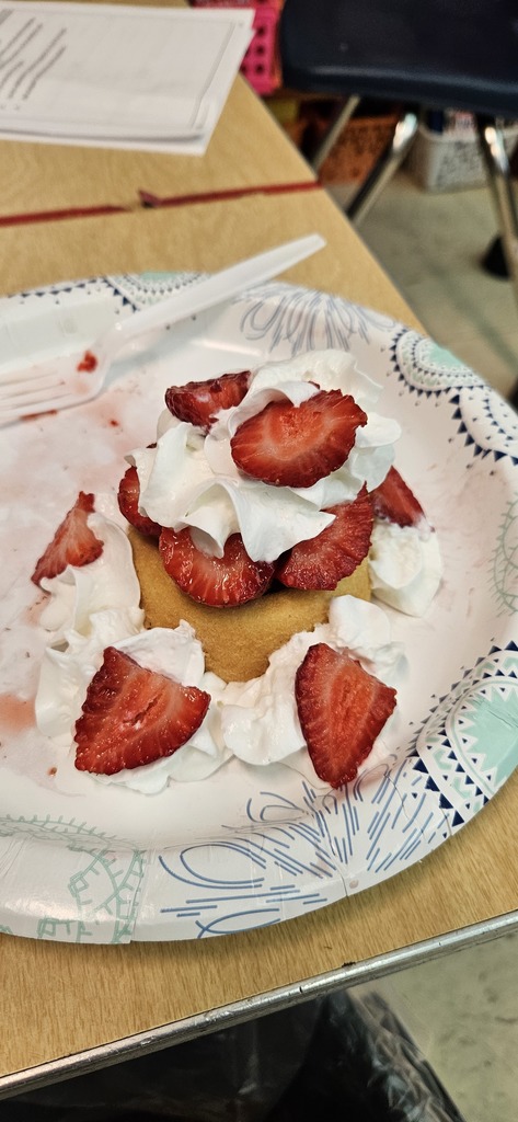 Students making strawberry shortcake.