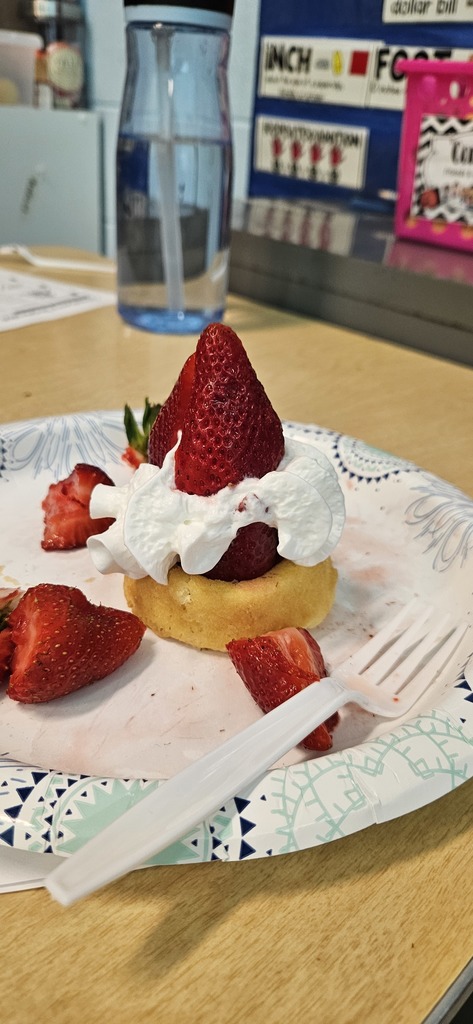 Students making strawberry shortcake.