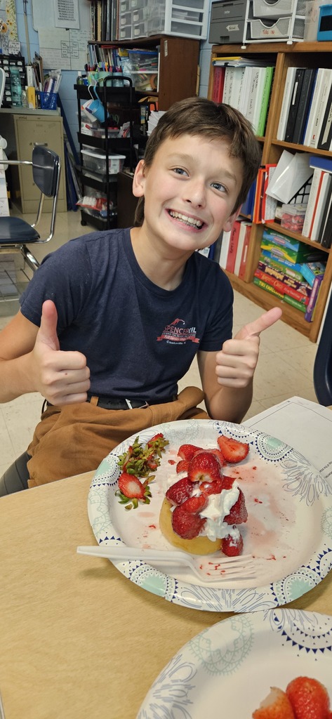 Students making strawberry shortcake.