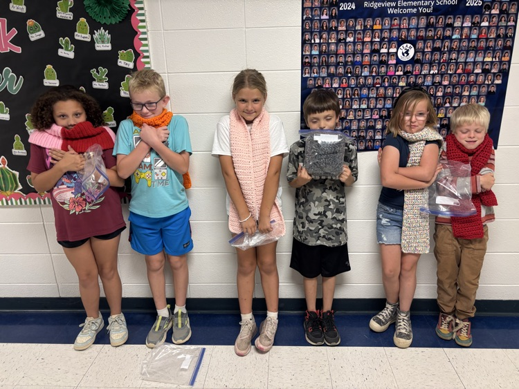 group of students in new jars and scarves