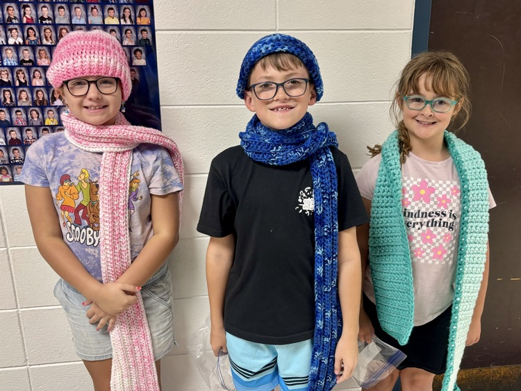 happy kids with new hats and scarves