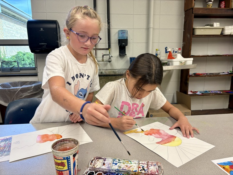 Painting in art class.